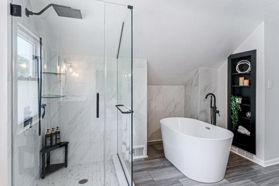 Primary bathroom with a freestanding soaking tub and a glass walk-in shower
